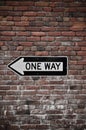 Brick Wall with One Way Sign Royalty Free Stock Photo