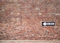 Brick Wall with One Way Sign Royalty Free Stock Photo