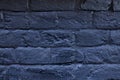 The brick wall painted in blue. Background of old vintage blue brick wall. Blue brick wall .Street light dark blue brick wall Royalty Free Stock Photo