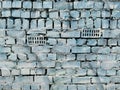 Old brick wall painted with blue and white paint. Royalty Free Stock Photo