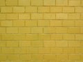 Brick wall painted in golden color