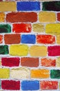 Brick wall painted in many colors. Royalty Free Stock Photo