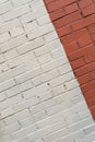 Brick wall painted white and red Royalty Free Stock Photo