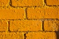 Brick wall painted yellow Royalty Free Stock Photo