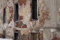 Brick wall with peeling plaster. A very old and abandoned building Royalty Free Stock Photo