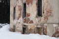 Brick wall with peeling plaster. A very old and abandoned building Royalty Free Stock Photo