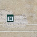 Brick wall and plate with a number ten Royalty Free Stock Photo