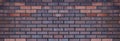 Brick Wall, Red purple grunge brick background, Horizontal backdrop wide Abstract with broken bricks texture, Old Vintage house Royalty Free Stock Photo