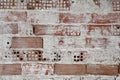 Brick wall with remaing plaster Royalty Free Stock Photo
