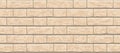 Brick beige wall seamless pattern background. Royalty Free Stock Photo