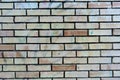 Brick wall with single orange bricks close up structure Royalty Free Stock Photo