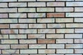 Brick wall with single orange bricks close up structure Royalty Free Stock Photo