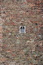 Brick wall with small window
