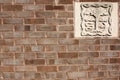 Brick Wall With Stone Carving