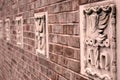 Brick Wall With Stone Carvings