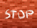Brick wall and stop text