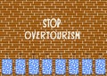 Brick wall with suitcases and words stop overtourism - cdr format Royalty Free Stock Photo