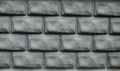 Brick wall texture. Gray, convex bricks of a building wall