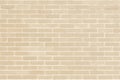 Brick wall texture pattern background in natural light ancient cream beige yellow brown color Royalty Free Stock Photo