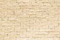 Brick wall tile texture background painted in light yellow cream color Royalty Free Stock Photo