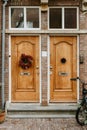 Brick wall with two wooden doors and details. Europe, travel concept. Lifestyle Royalty Free Stock Photo