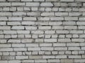 A brick wall of white old broken bricks. Royalty Free Stock Photo