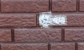 A brick wall with a white sticker on it Royalty Free Stock Photo