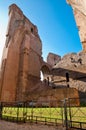 Brick walls ruins and fence on caracalla springs at Rome