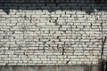Brick white wall with barbed wire Royalty Free Stock Photo
