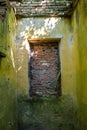 A bricked-up window in an old building