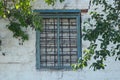 Bricked window and grate in an abandoned house in Ukraine