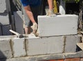 Bricklayer builder laying autoclaved aerated concrete blocks, aac for new house wall. Autoclaved aerated concrete blocks walling