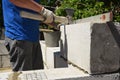 Bricklayer builder laying autoclaved aerated concrete blocks, aac for new house wall.  Autoclaved aerated concrete blocks walling Royalty Free Stock Photo