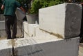 Bricklayer builder laying autoclaved aerated concrete blocks, aac for new house wall.  Autoclaved aerated concrete blocks walling Royalty Free Stock Photo