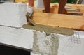 Bricklayer builder laying concrete on autoclaved aerated blocks wall Royalty Free Stock Photo