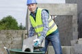 bricklayer builder working with autoclaved aerated concrete blocks