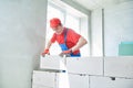 Bricklayer builder working with autoclaved aerated concrete blocks. Walling Royalty Free Stock Photo