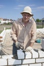 Bricklayer builds a wall Royalty Free Stock Photo