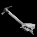 Bricklayer hammer- tools in a man`s hand - black and white phot Royalty Free Stock Photo