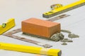 Bricklayer installing bricks, Bricklayer worker installing brick Royalty Free Stock Photo