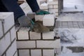Bricklayer levels cement, makes a concrete wall, construction of a residential building. Royalty Free Stock Photo