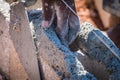 Bricklayer/mason applying wet cement on concrete blocks