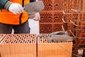 Bricklayer and mason working with bricks and building interior walls of house Royalty Free Stock Photo