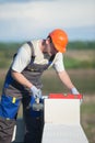 Bricklayer places cinder blocks