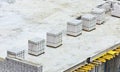 Bricklayer work on a building site - place of work of bricklaying worker on a construction site of a big residential house. White