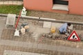 Bricklayer at work laying stone blocks.