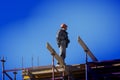 A bricklayer worker erects a wall on the construction of a multi-storey building Royalty Free Stock Photo