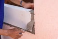 Bricklayer worker installing Lightweight Concrete on exterior wall with trowel putty knife Royalty Free Stock Photo