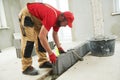 Bricklayer working with ceramsite concrete blocks. Walling