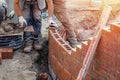 Bricklayer working on a curved wall